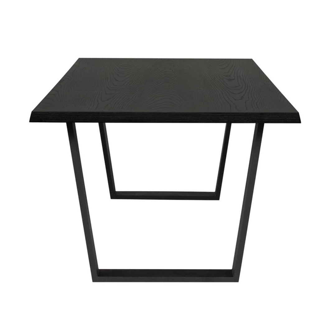 End view of the geometric black steel legs and wood veneer table top on the Laval Dining Table.