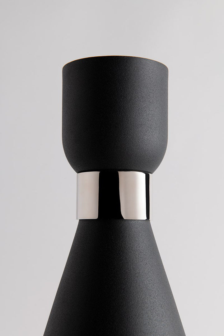 Black coned lamp shade with polished nickel cuff for a modern looking wall sconce.