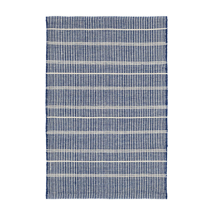 Navy Indoor / Outdoor Rug. Striped blue and white rug made out of recycled plastic bottles.